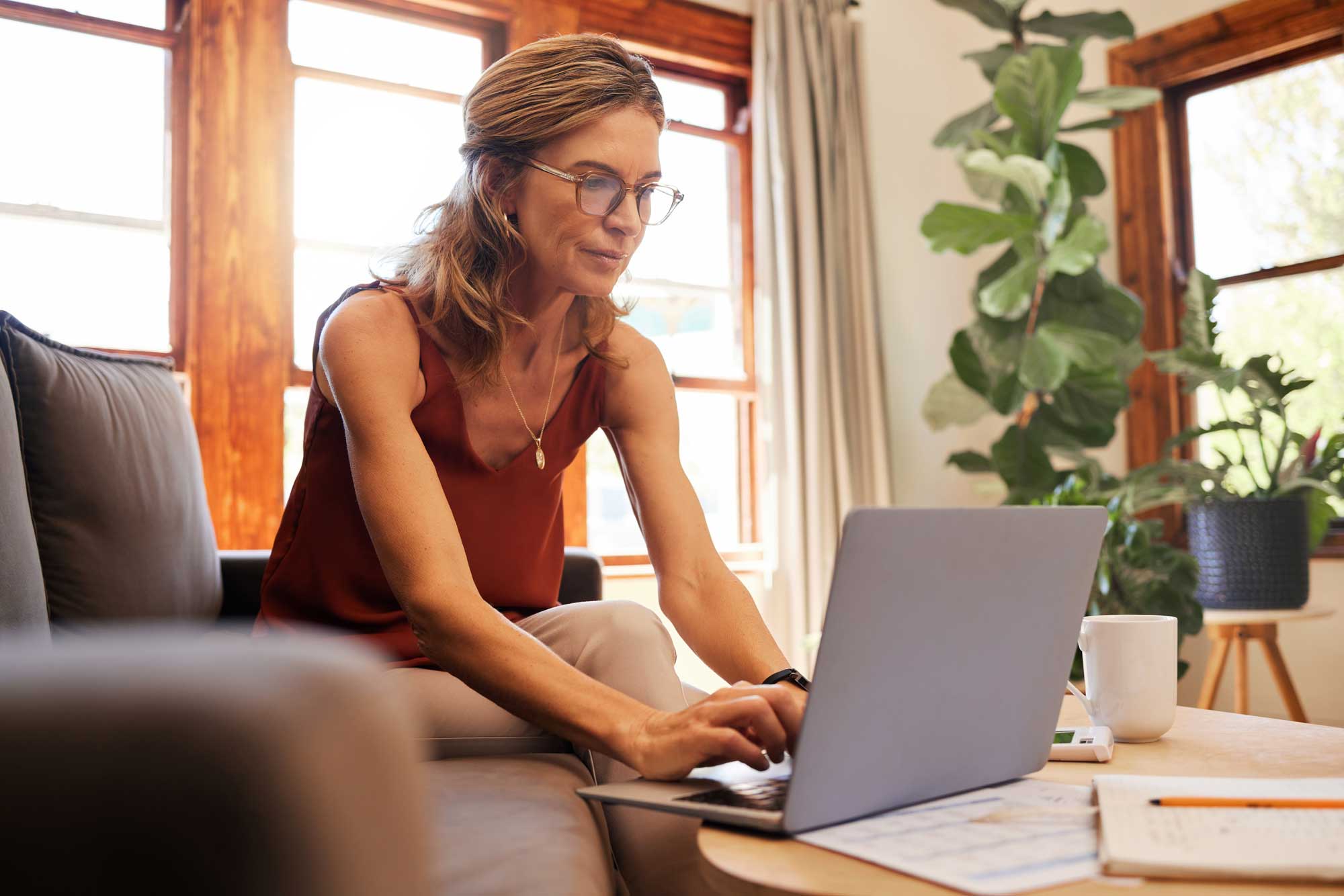 Senior woman on laptop for finance and investment planning